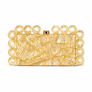 Macro detail of gold crinkle texture acrylic clutch with circular ring accents