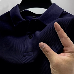 Men's navy blue polo shirt featuring breathable pique knit fabric and standard lapel collar