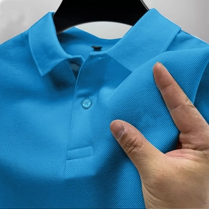 Close-up of bright blue polo shirt featuring breathable piqué cotton mesh texture