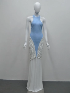 Detail view of the side ruching and color-block stitching on this fishtail halter dress