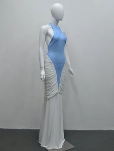 Detail view of V-shaped ruching and pleats on white mermaid evening dress skirt