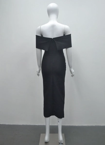 Close-up of the back invisible zipper detail on this elegant black off-shoulder midi dress