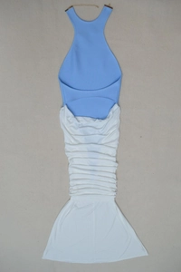 Detail of blue and white halter neck maxi dress with pleated texture and fishtail hemline