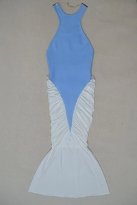 Detailed flat lay of halter neck fishtail dress with gold chain and pleated mermaid skirt
