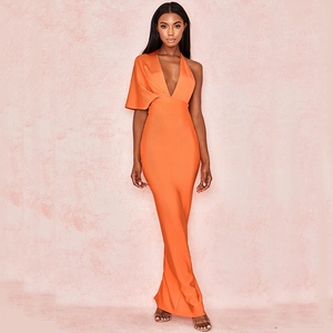 Close-up of bright orange bandage evening dress featuring deep V-neck and asymmetric sleeve