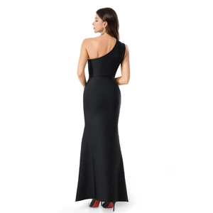 Detail view of the sleek backless design and slim fit mermaid silhouette of this black dress
