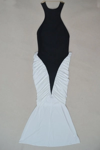 Detail of elegant black halter neck with gold metal bar and pleated white mermaid dress