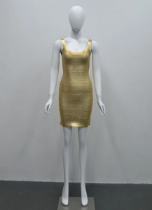 Detail of gold metallic bandage dress showing ribbed texture and shimmering fabric
