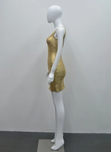 Detail view of gold bandage dress texture and form-fitting backless side profile