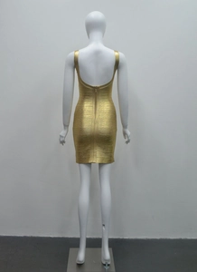 Close-up of gold metallic bandage dress back featuring a long gold zipper and deep U-back