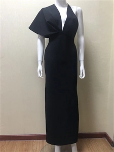 Detail of elegant black bandage evening gown featuring ruffled one-shoulder design and deep V-neck