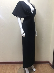 Detail of elegant black deep V-neck bandage evening dress with unique cape sleeve design