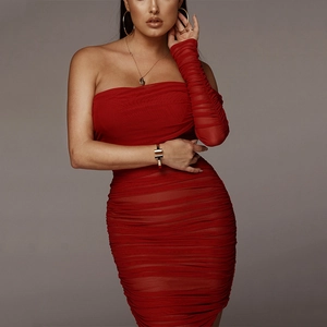 Detailed view of red ruched mesh bodycon dress texture and single long sleeve glove