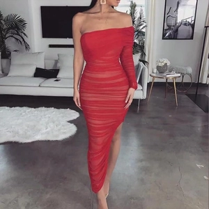 Detail of red asymmetric one-shoulder dress showing mesh pleats and ruched texture