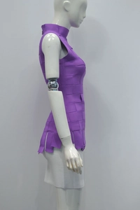 Detail view of the purple high-neck sleeveless bandage top with modular woven texture and fringe