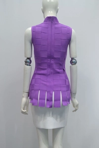 Back view of purple sleeveless top with woven grid texture and tassel hem detail