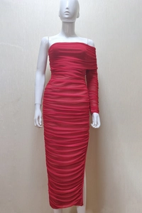 Detail of red ruched mesh evening dress with asymmetric one-shoulder design and slim fit