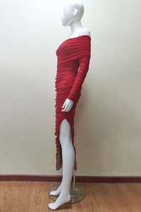 Detail showing red off-shoulder pleated fabric with elegant high side slit of the gown