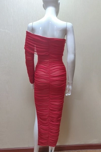 Detail view of red ruched mesh asymmetric dress with side slit on a mannequin
