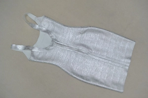 Detail shot of silver metallic bandage dress fabric texture and shimmery coating