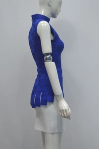 Side view of royal blue sleeveless turtleneck bandage top with unique woven texture