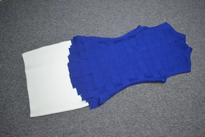 Detail of royal blue high-neck vest dress with textured knit pattern and back zipper