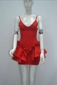 Detail of red bandage dress featuring V-neck corset bodice and ruffle skirt details