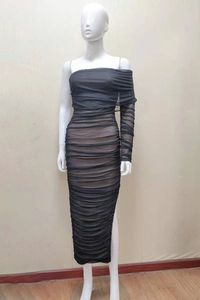 Detail of elegant black pleated mesh dress with asymmetrical one-shoulder and high side slit