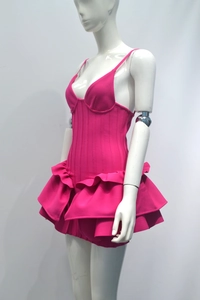 Detailed side view of rose red tiered ruffle dress with vertical knit texture and strap design