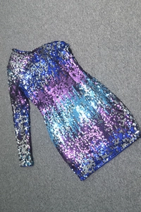Detail of gradient sequins on a one-shoulder purple and blue sparkling mini dress