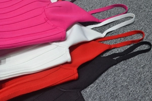 Detail of ribbed bandage fabric texture and stitching in four vibrant colors