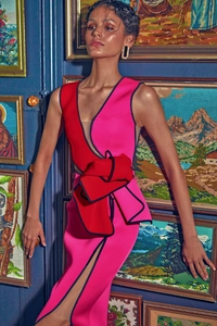 Detail of elegant sleeveless bandage dress with mesh paneling and a 3D bicolor bow