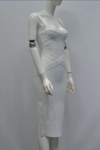 Detail of white bandage dress showing thick cross straps and textured vertical stripe fabric