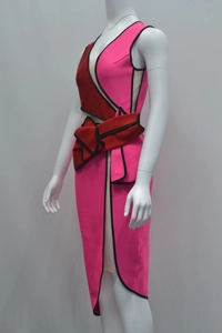 Detail of elegant two-tone pink and red sleeveless bandage dress with black piping and bow