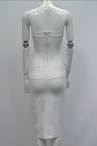 Detail view of white bandage dress featuring back zipper closure and ribbed bodycon texture