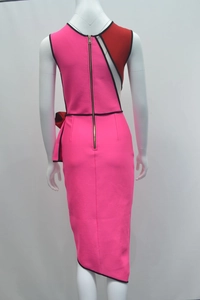 Detail of a pink bandage dress with red hollow-out panels and a gold back zipper
