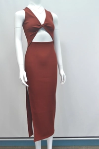 Detailed view of rust red ribbed knit fabric with waist cutout and side slit design