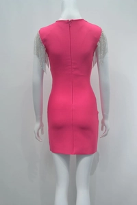 Detail of rose pink bandage dress featuring luxury silver rhinestone tassel shoulders