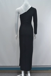 Detail of black one-shoulder long sleeve dress with slim fit and floor-length design