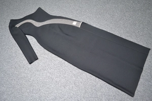 Detail view of black bodycon evening dress with mesh cutout and elegant side slit