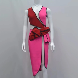 Elegant sleeveless patchwork dress featuring red and fuchsia cut-outs and ruffles