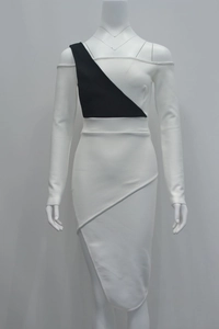 Detailed view of black and white contrast one-shoulder bandage dress with asymmetric hem