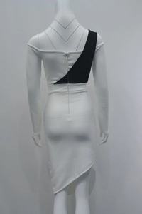 Detail view of back zipper and geometric black and white paneling on the shoulder dress
