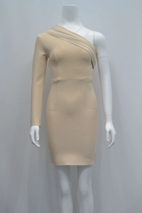 Detail view of apricot one-shoulder dress showing elegant ruched neckline and textured fabric