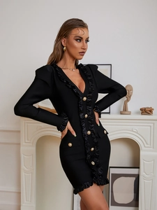 Detailed view of golden buttons and ruffled edges on a black V-neck mini bandage dress