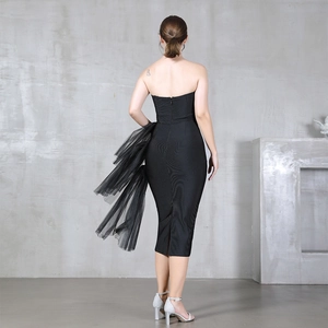 Elegant black strapless bandage dress featuring a side mesh ruffle and back slit detail