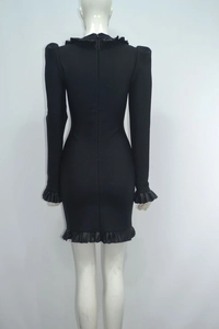 Detail of black long sleeve bandage dress featuring ruffle trim and back invisible zipper