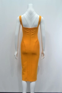 Detail view of the back zipper closure on a slim fit yellow bandage midi dress