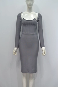Detail of the elegant grey knit dress featuring a structured corset-style off-shoulder neckline