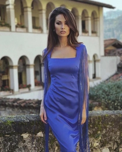 Detail of royal blue bodycon dress featuring long fringe sleeves and square neckline